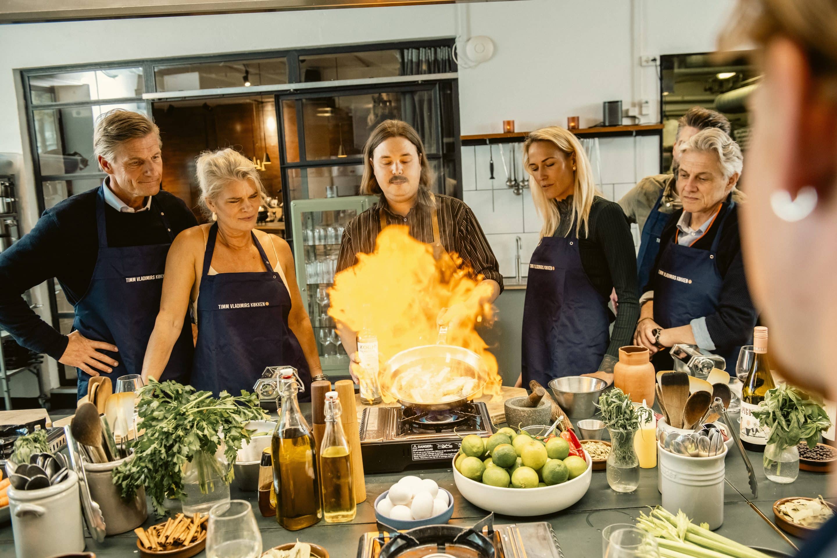 Colleagues cooking together during a team building event in Copenhagen